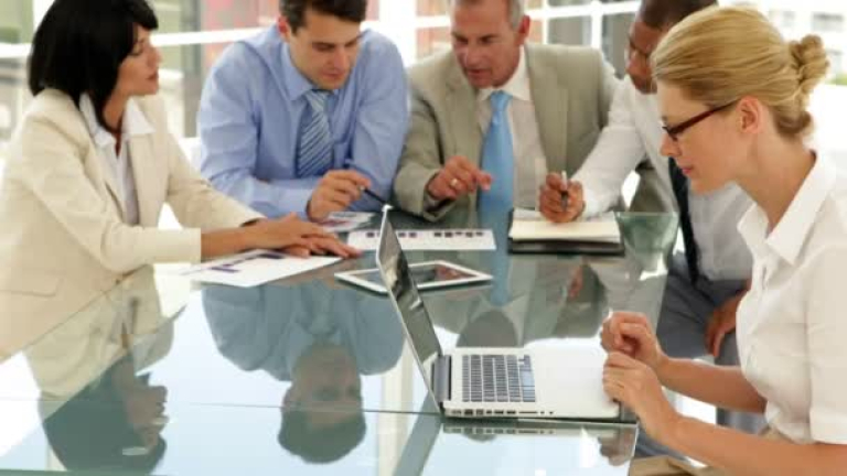 depositphotos_39159187-stock-video-business-people-working-hard-together